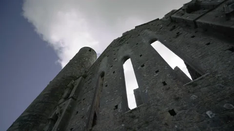 Clouds pass over old wall of ruined castle in Ireland Stock Footage 169979250