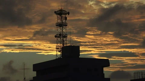 Clouds Pass Over Silhouetted Cell Radio Tower In Tokyo At Sunset Stock Footage 50731814