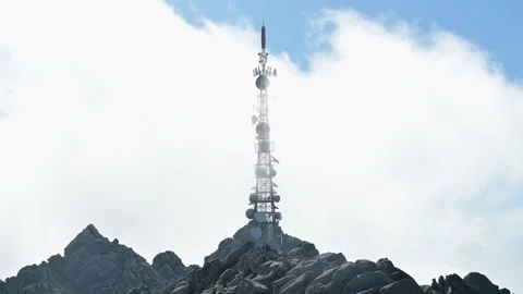 Clouds pass quickly over a communications tower antenna Stock Footage 142757960