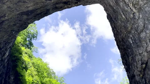 Clouds pass through Natural Bridge Stock Footage 335479166