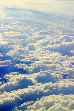 Clouds pass under wing of plane Stock Photos
