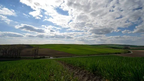 Clouds passing above rural fields in South Moravia, Czech Republic. Stock Footage 129489440