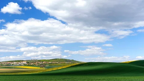 Clouds passing above rural fields in South Moravia, Czech Republic. Stock Footage 129490010