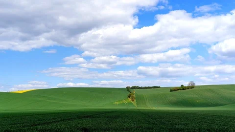 Clouds passing above rural fields in South Moravia, Czech Republic. Stock Footage 129663571