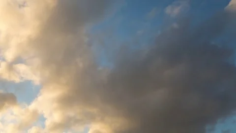 Clouds Passing Across a Blue Sky at Sunset Video stock 76853452