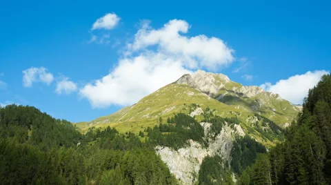 Clouds passing alpine mountain Stock Footage 65029963