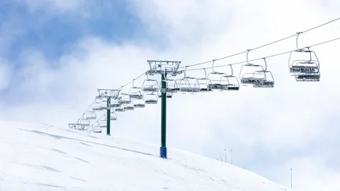 Clouds Passing Behind Abandoned Ski Chairlift in Winter Stock Footage 137840856