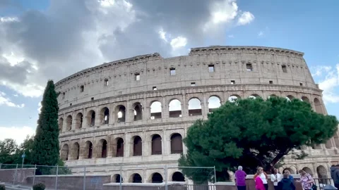 Clouds passing behind the imposing Roman Colosseum Stock Footage 262581832