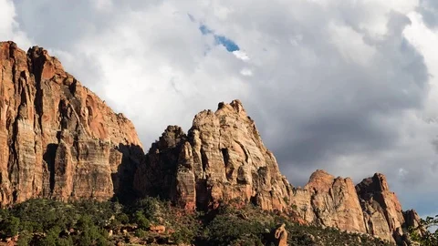 Clouds passing behind a mountain Video stock 82470587