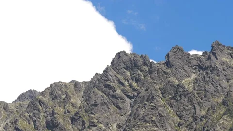 Clouds passing behind mountains in the High Tatras. Panning shot in 4k. Stock Footage 168346944