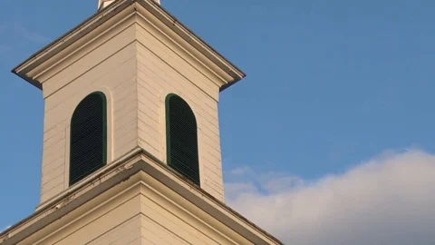 Clouds passing behind white steeple Stock Footage 83666409