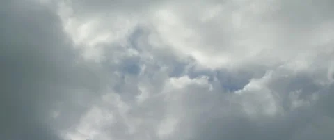 Clouds passing fast on the sky 5.7K anamorphic video Stock Footage 318728982