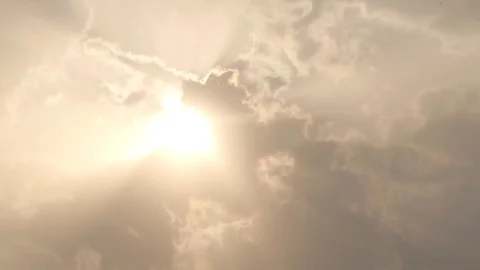 Clouds passing in front of the sun camera facing at sun Stock Footage 94321050