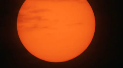 Clouds passing in front of the Sun Stock Footage 24487526