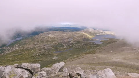 Clouds passing Gaustatoppen hill and Telemark landscape near Rjukan Norway Stock Footage 88835999