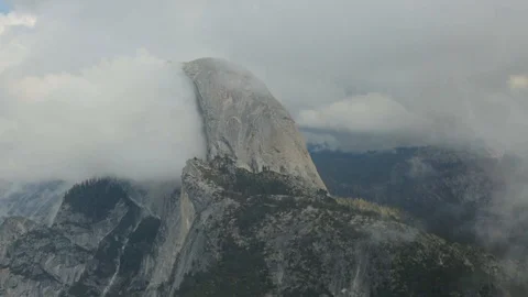 Clouds Passing Half-Dome Mountain Stock Footage