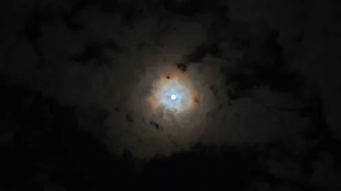 Clouds passing by moon at night. Full moon at night with cloud real time. Stock Footage 146038380
