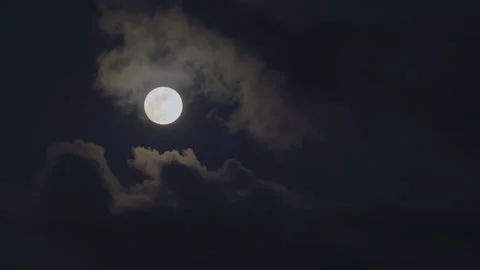 Clouds passing by moon at night. Mystery fairyland scene. Stock Footage
