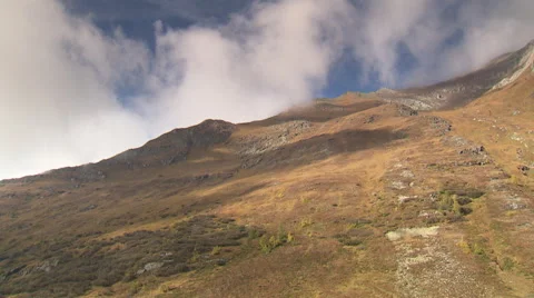 Clouds passing mountain crest Stock Footage 59318727