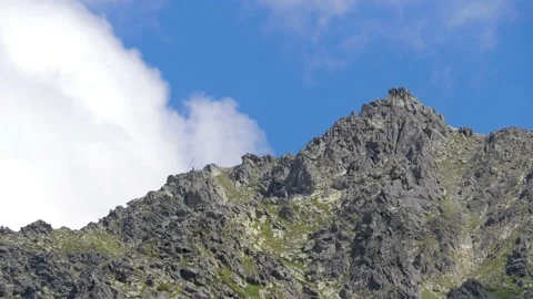 Clouds passing by mountain peaks in the High Tatras, Slovakia. 4k Stock Footage 168346950
