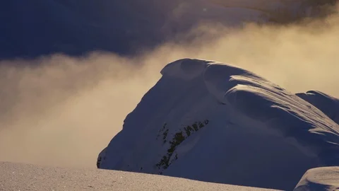 Clouds passing by on mountain top Stock Footage 102170679