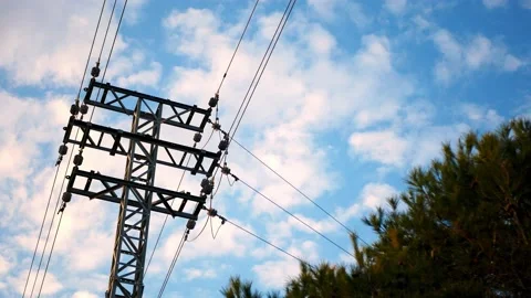 Clouds passing over an electric tower Video stock 170419911