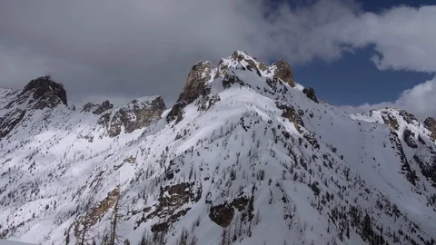 Clouds passing over high alpine mountains Video stock 120059664