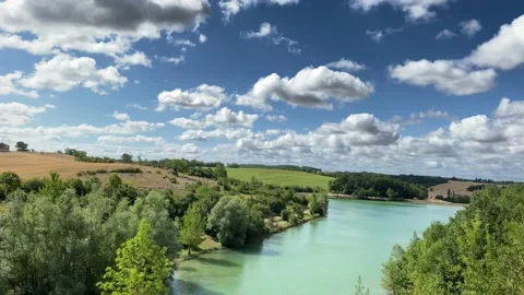Clouds Passing Over The Hills And Lake - 4K Stock Footage 142710012