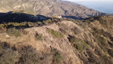 Clouds Passing Over Malibu Mountains in Bright Sunlight Stock Footage 300867615