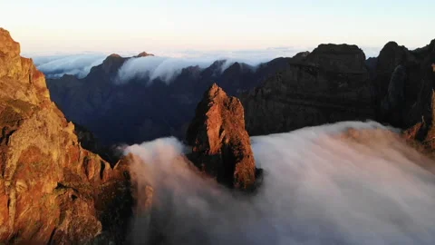 Clouds passing over the mountain during the sunrise 10x speed up Stock Footage 269164736