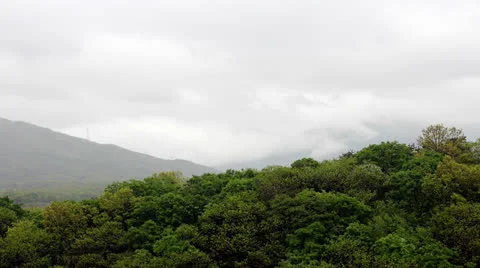 Clouds passing over mountain Video stock 24636099