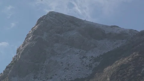 Clouds passing over a mountain Stock Footage 71720712
