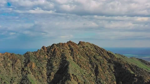 Clouds passing over mountain peak and valley Stock Footage 314450579
