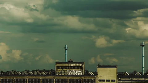 Clouds passing by over old abandoned factory with graffiti on it's wall Stock Footage 37354080