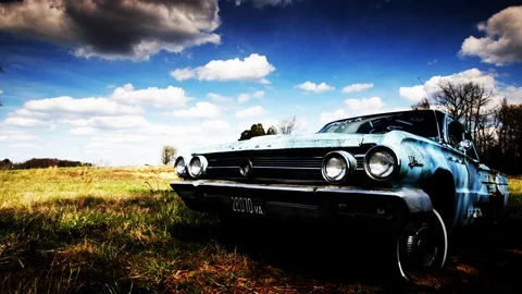 Clouds passing over an old car Stock Footage 91222563