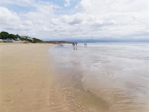 Clouds passing over Plettenberg beach at low tide Stock Photos