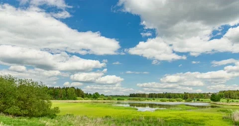 Clouds passing on sky over a lake Stock Footage 195323717