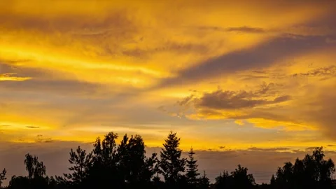 Clouds passing on sunset sky time lapse Stock Footage 264101950