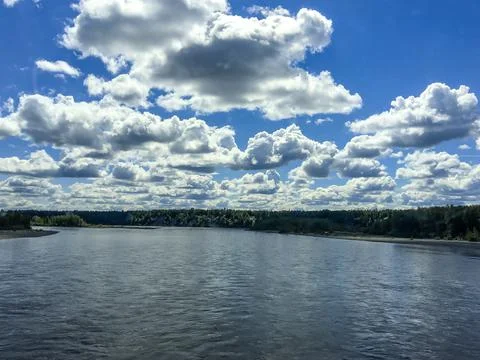Clouds passing through during a blue sky Stock Photos