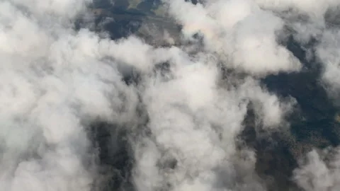 Clouds passing under plane Stock Footage 146550691