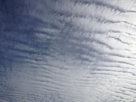 Clouds pattern look like tiger skin with bright blue sky Stock Photos