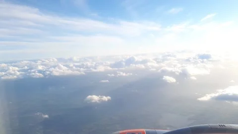 Clouds Plane Flight Window View Daytime with Sunshine Stock Footage 230913402