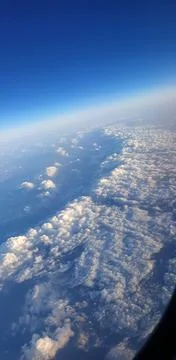 Clouds from the plane window Stock Photos