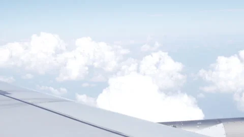 Clouds from Plane Window Seat Stock Footage 291509987