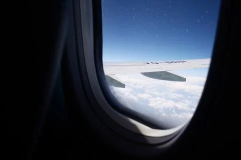 Clouds from a porthole, from a height of flight Stock Photos
