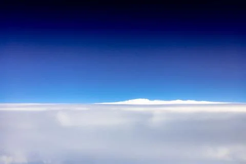 Clouds from the porthole. Stock Photos