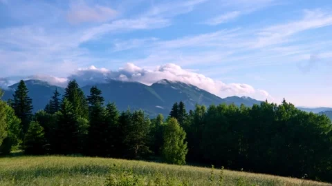 Clouds pour over the mountains in the Carpathian mountain landscape in summer Stock Footage 301647985