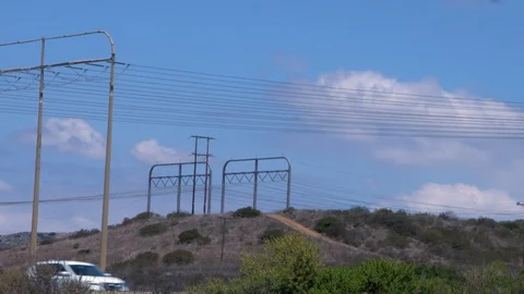 Clouds Power Lines and Freeway Stock Footage 90526117