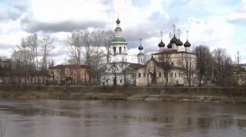 Clouds quickly float above the river , bridge and temple in the background Stock Footage 49187456