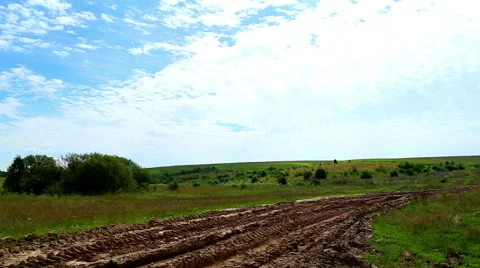 Clouds quickly go through the sky, shadow on the road ,  landscape,  blue sky Stock Footage 40525863